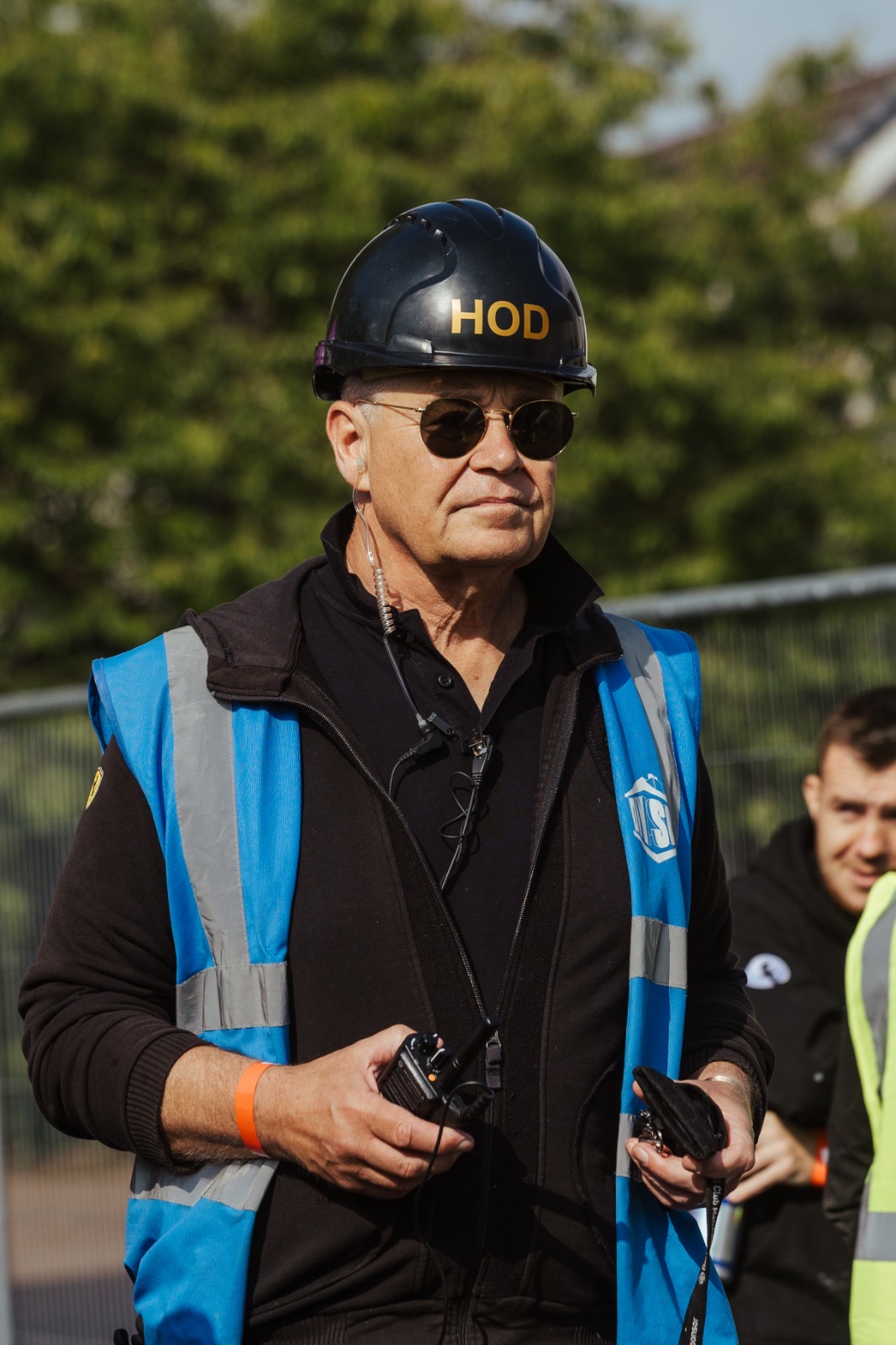Ian Hodgkinson wearing a hard hat and high-visibility construction clothing